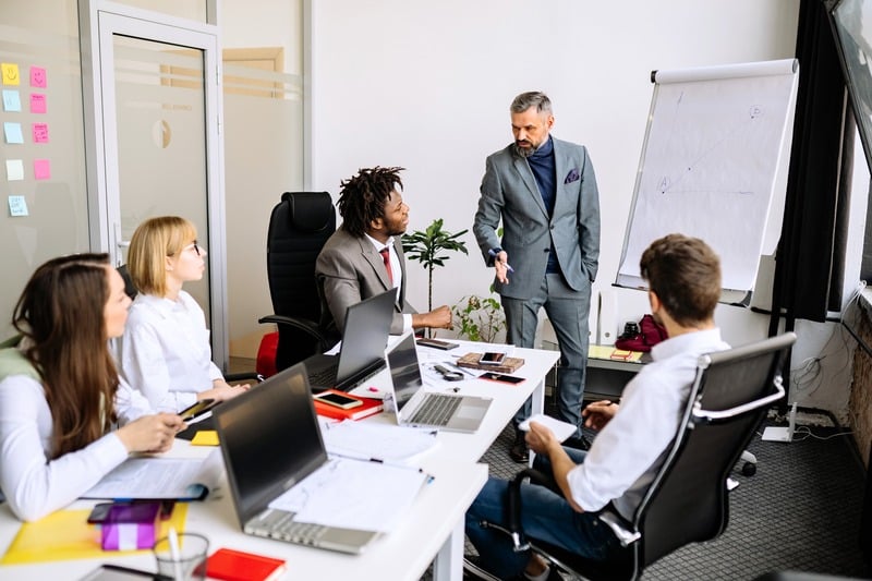 Tenant representation team meeting in an office
